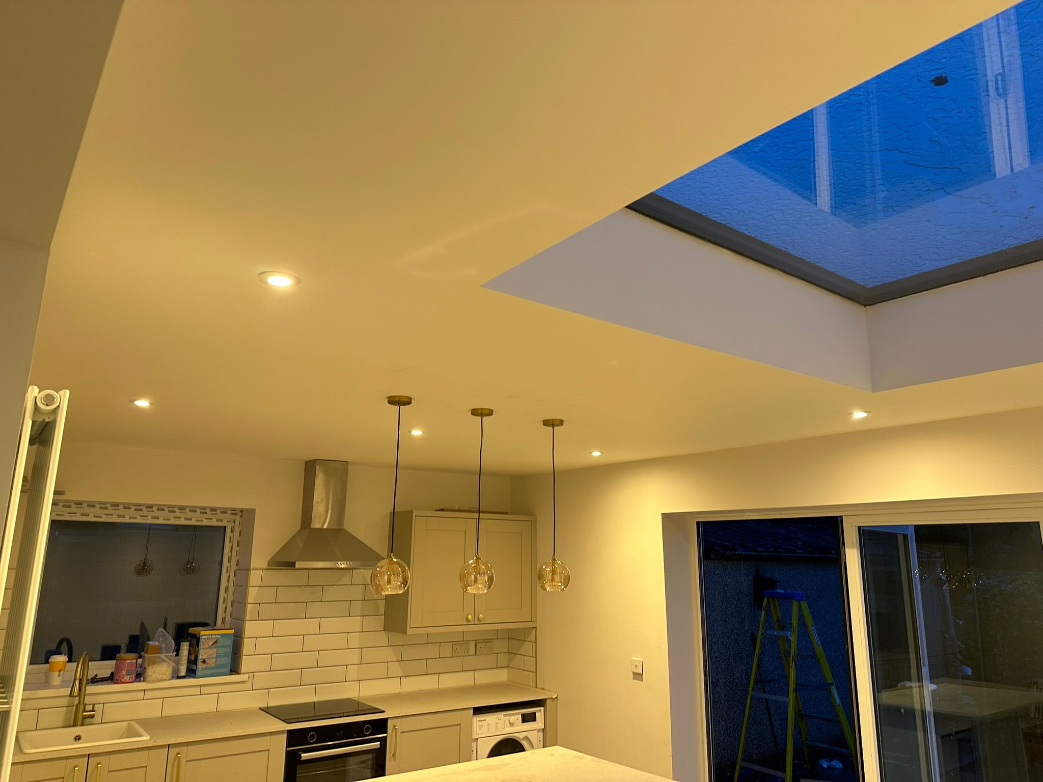 Kitchen with skylight and pendants